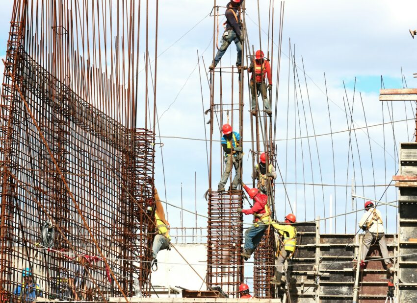 people working on building during daytime